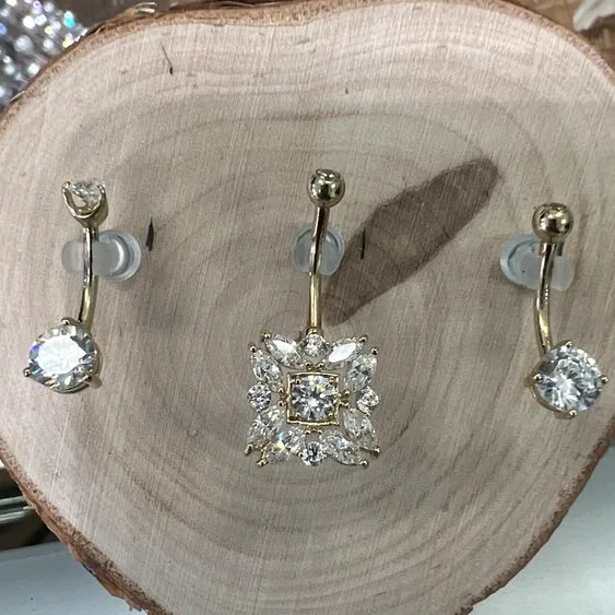 Implant-grade gold jewelry with cubic-zirconia detail, from the case